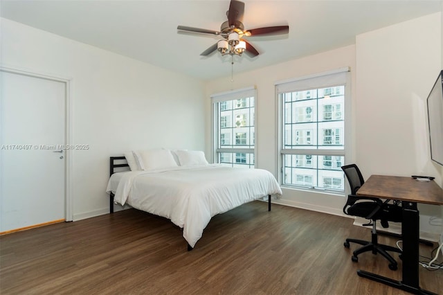 bedroom featuring dark hardwood / wood-style floors and ceiling fan