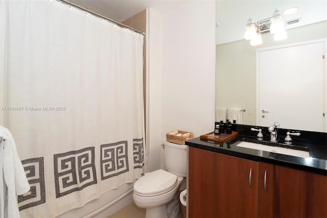 full bathroom featuring vanity, toilet, and shower / bath combo with shower curtain