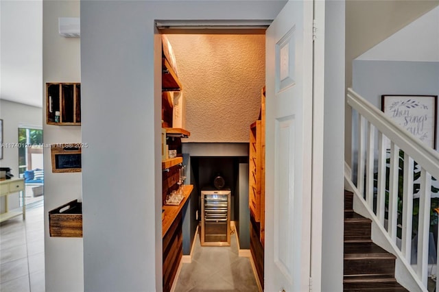 hall with light tile patterned floors