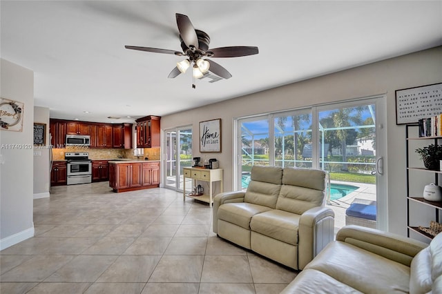 tiled living room with ceiling fan