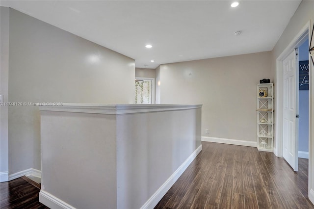 corridor with dark hardwood / wood-style floors