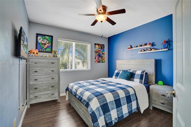 bedroom featuring ceiling fan and dark hardwood / wood-style flooring