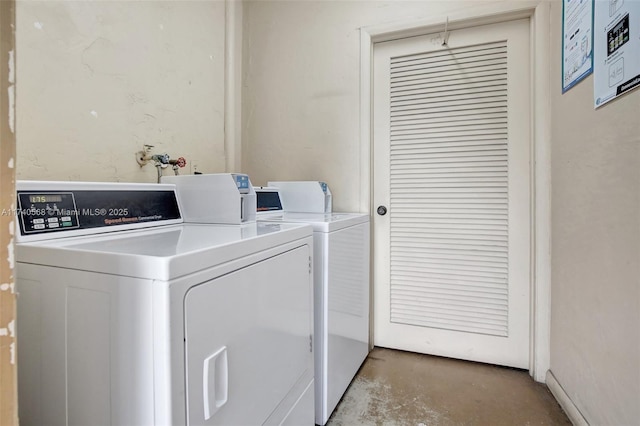 laundry area with independent washer and dryer