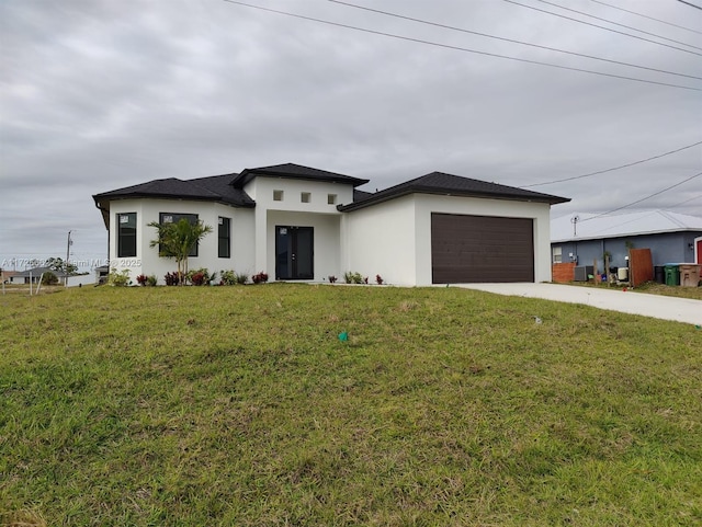 view of front facade with a garage and a front yard