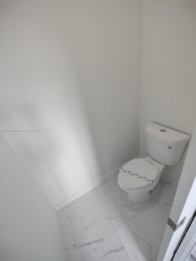 bathroom featuring toilet