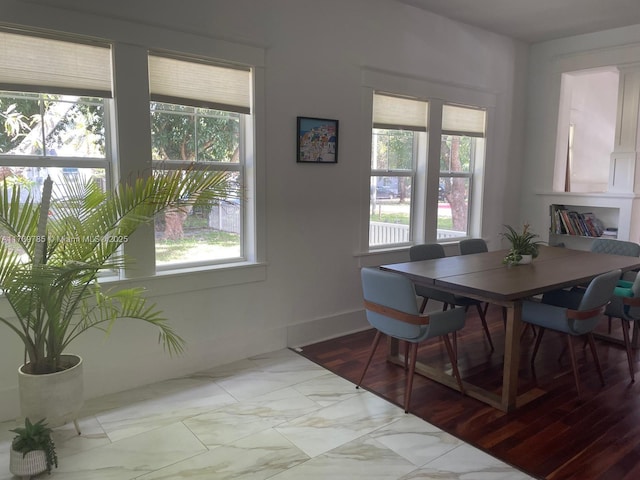 dining room with marble finish floor