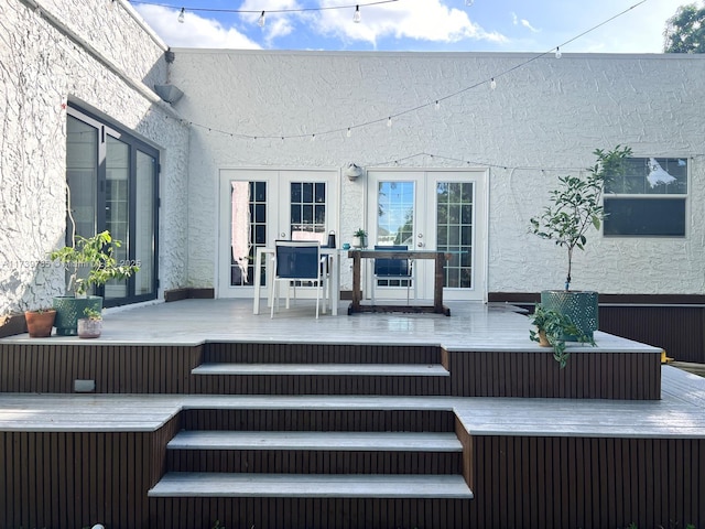 wooden deck featuring french doors