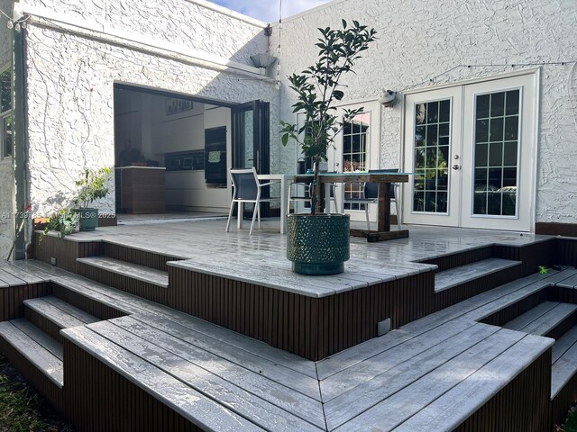 wooden terrace featuring french doors