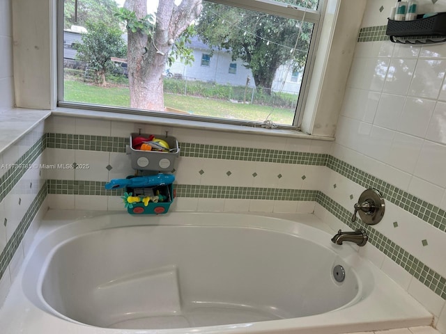 bathroom featuring a tub