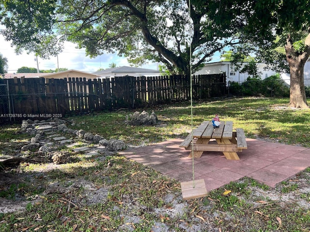 view of yard with a fenced backyard and a patio