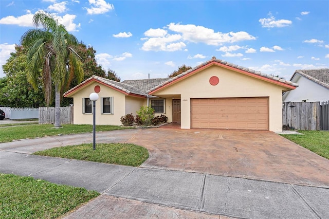 view of front of home with a garage and a front yard