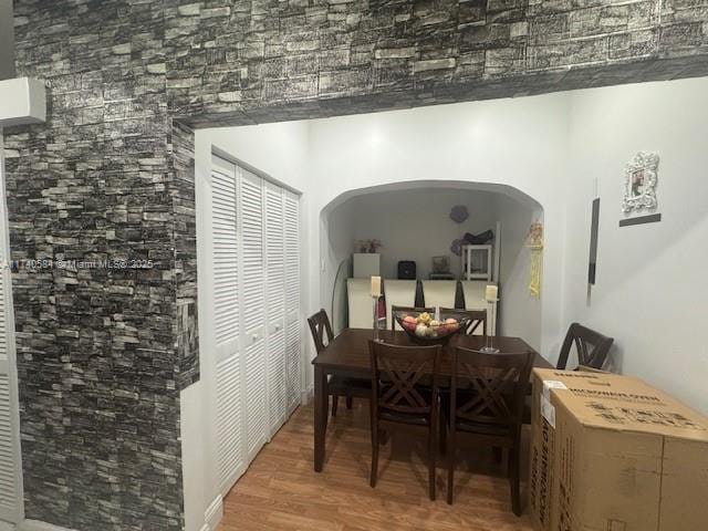 dining area with wood-type flooring