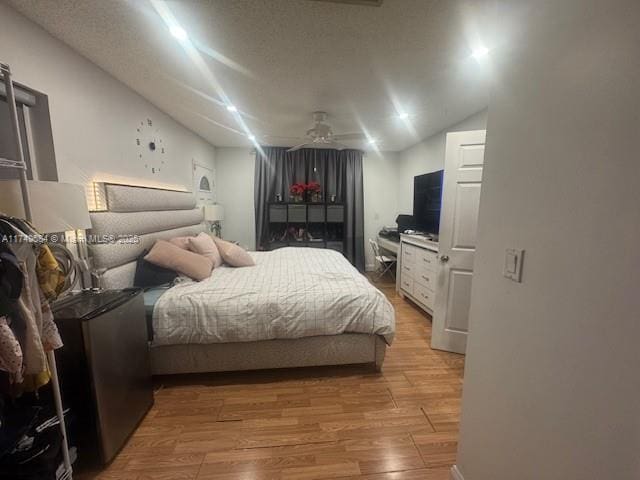 bedroom with hardwood / wood-style floors and ceiling fan