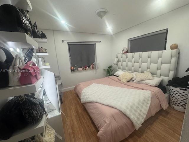 bedroom featuring wood-type flooring