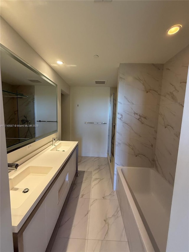 bathroom featuring vanity and separate shower and tub