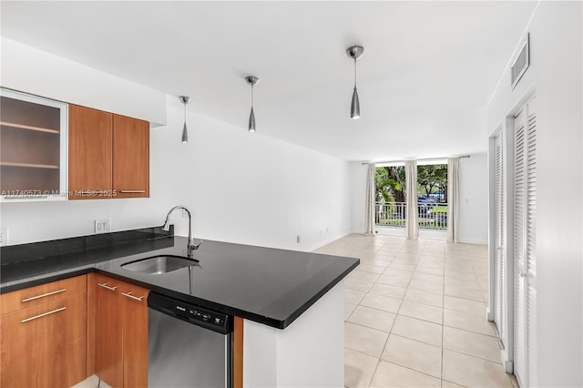 kitchen featuring sink, light tile patterned floors, dishwasher, kitchen peninsula, and a wall of windows