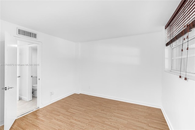 empty room with light wood-type flooring