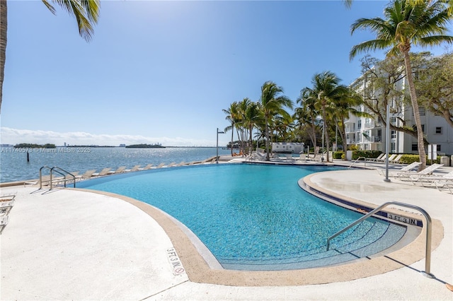 view of pool featuring a water view