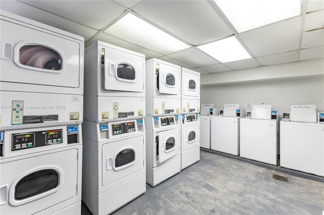 laundry area featuring stacked washer / drying machine and washer and clothes dryer