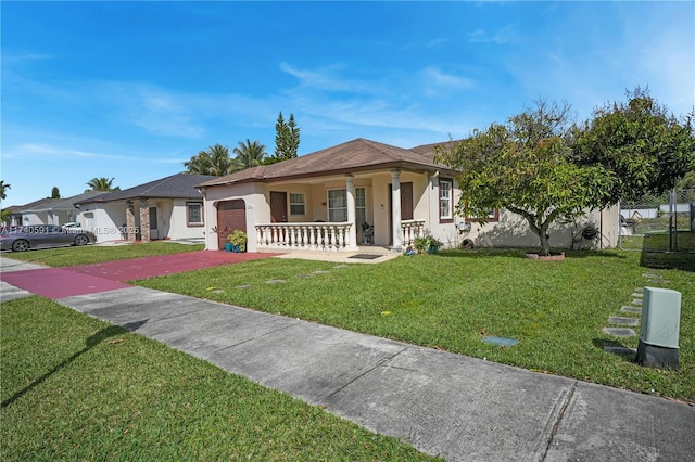 view of front of home featuring a garage and a front lawn