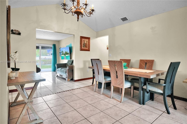 tiled dining area with an inviting chandelier, high vaulted ceiling, and a textured ceiling