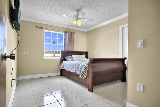 bedroom featuring ceiling fan, light tile patterned floors, ornamental molding, and a textured ceiling