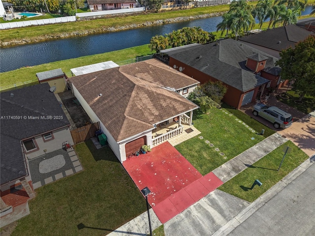 birds eye view of property featuring a water view