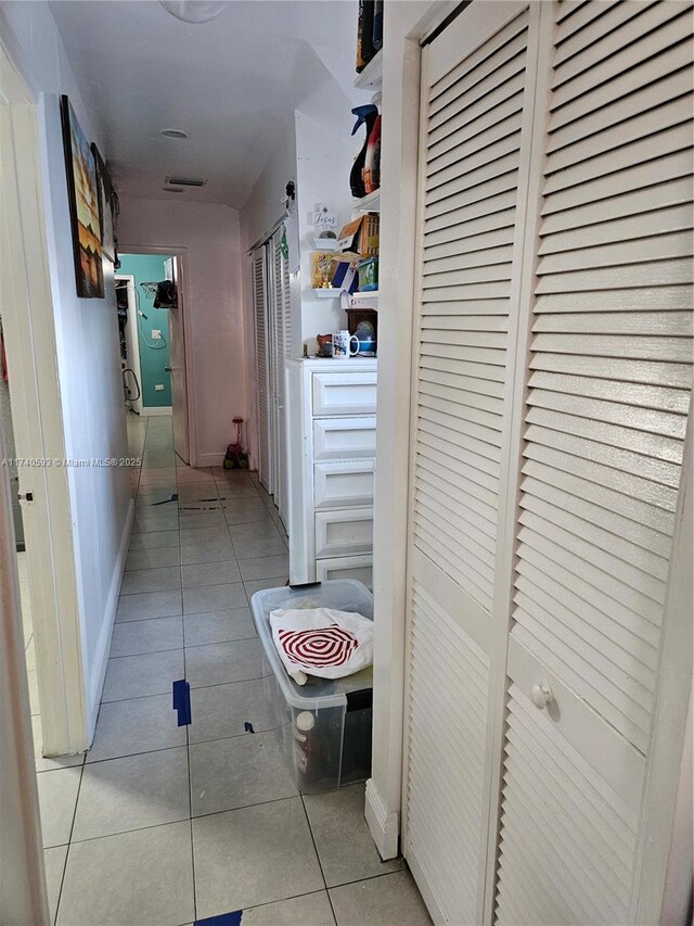 1260 NW 4th St, Miami, FL 33125 - hallway with light tile patterned floors and baseboards