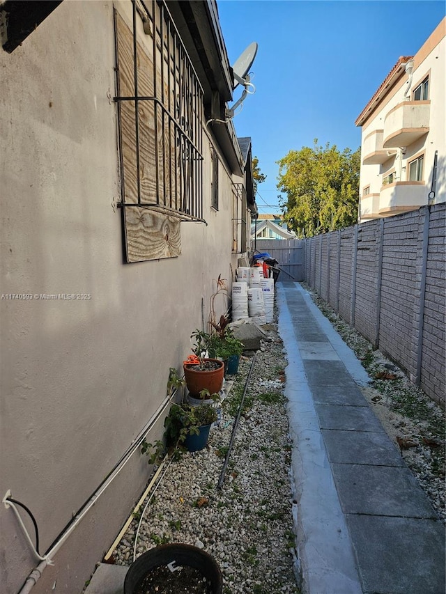 1260 NW 4th St, Miami, FL 33125 - view of side of property featuring a fenced backyard and stucco siding