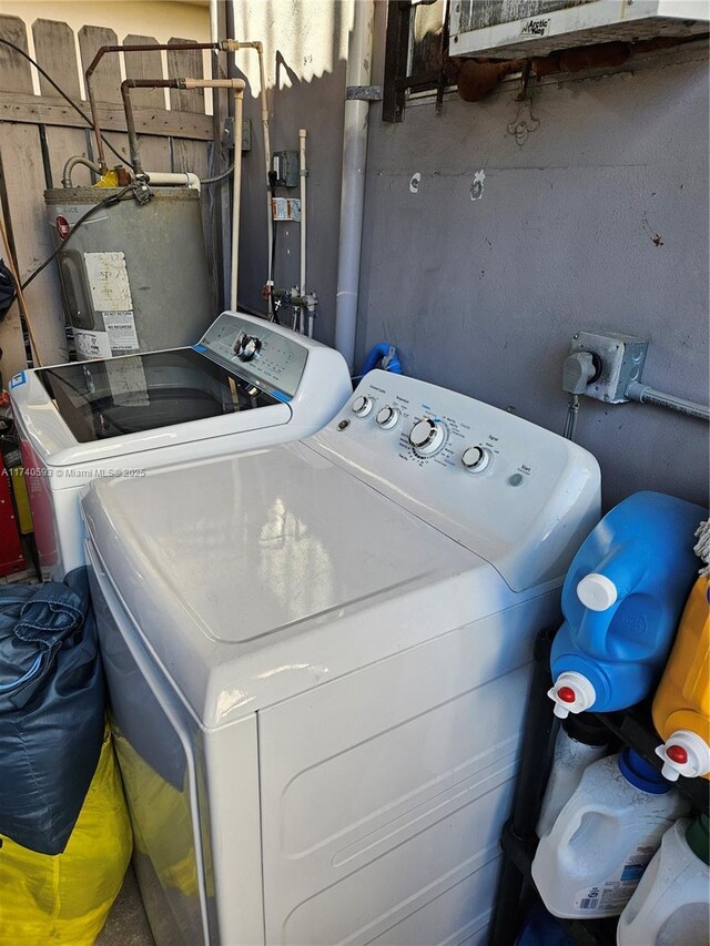 1260 NW 4th St, Miami, FL 33125 - laundry area with washer and dryer and electric water heater