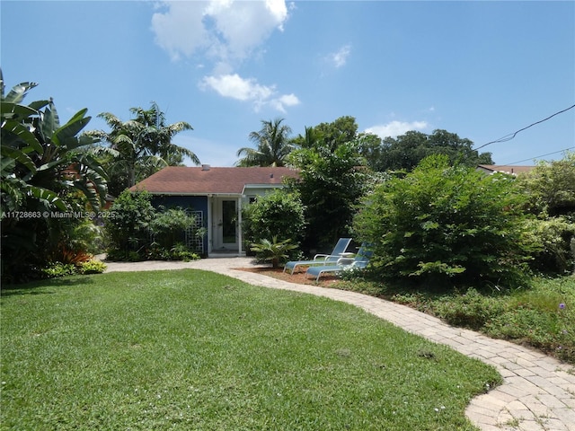 obstructed view of property featuring a front yard