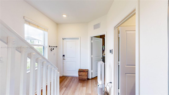 hall with light wood-type flooring