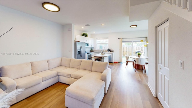 living room featuring light wood-type flooring