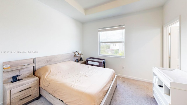 bedroom featuring light carpet