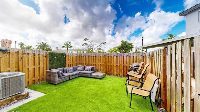 view of yard with an outdoor hangout area and central air condition unit