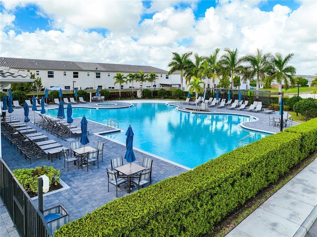 view of swimming pool with a patio