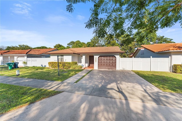 view of front of property with a garage and a front yard