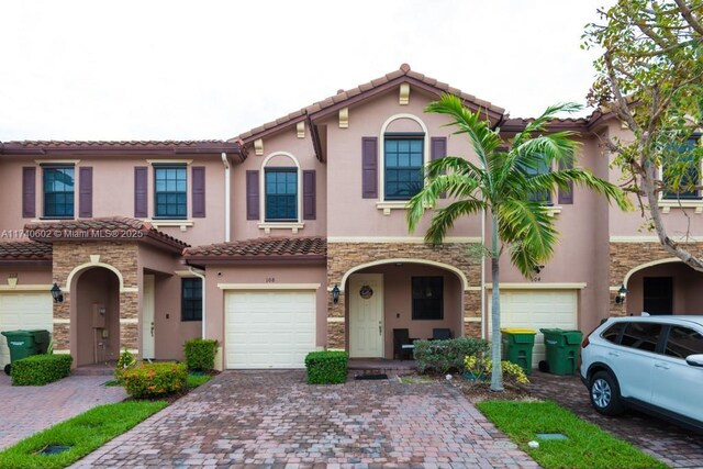 view of front of property with a garage