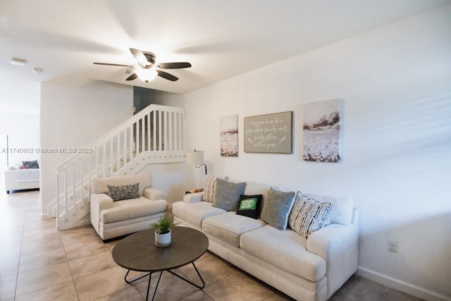 living room featuring tile patterned flooring and ceiling fan