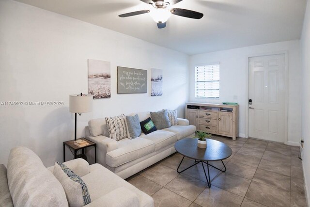 tiled living room featuring ceiling fan