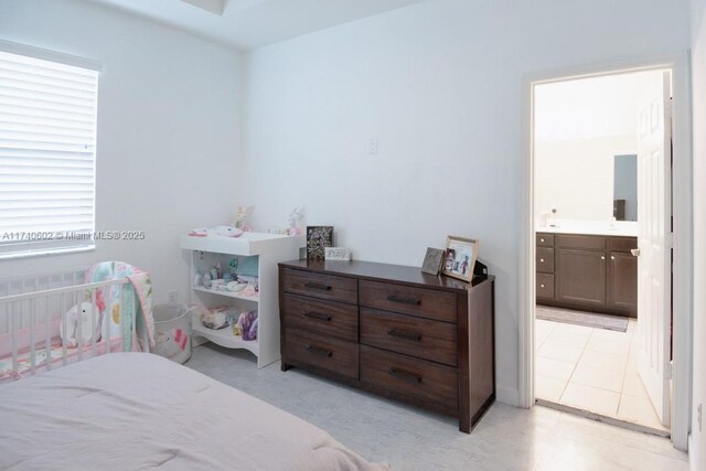 bedroom featuring ensuite bathroom