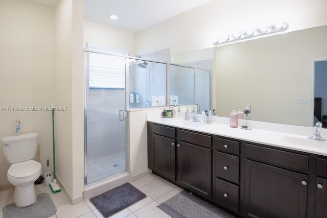 bathroom with vanity, toilet, an enclosed shower, and tile patterned flooring