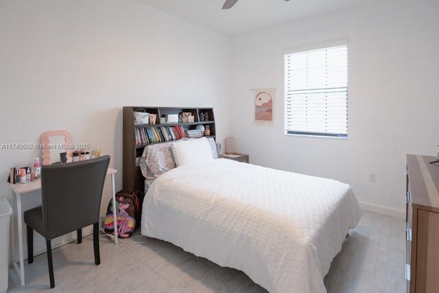 bedroom with ceiling fan and light hardwood / wood-style floors