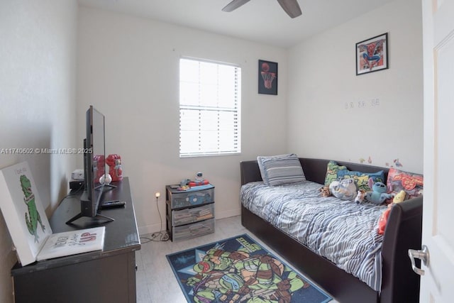 bedroom with light hardwood / wood-style floors and ceiling fan