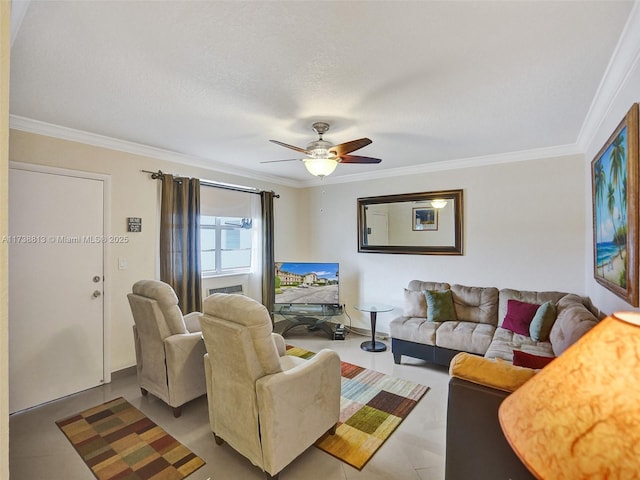 living room featuring ceiling fan, ornamental molding, and a textured ceiling