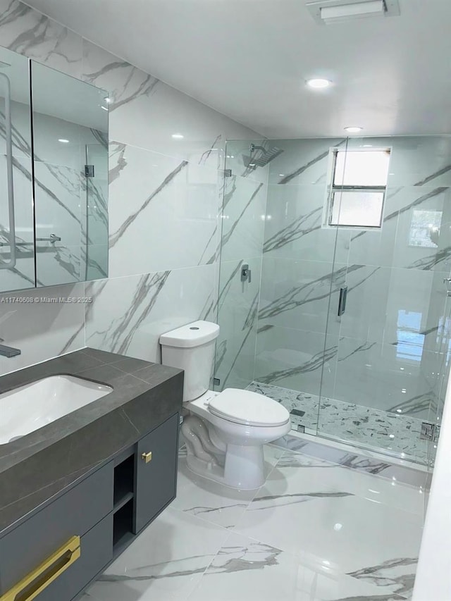 bathroom with vanity, an enclosed shower, and toilet