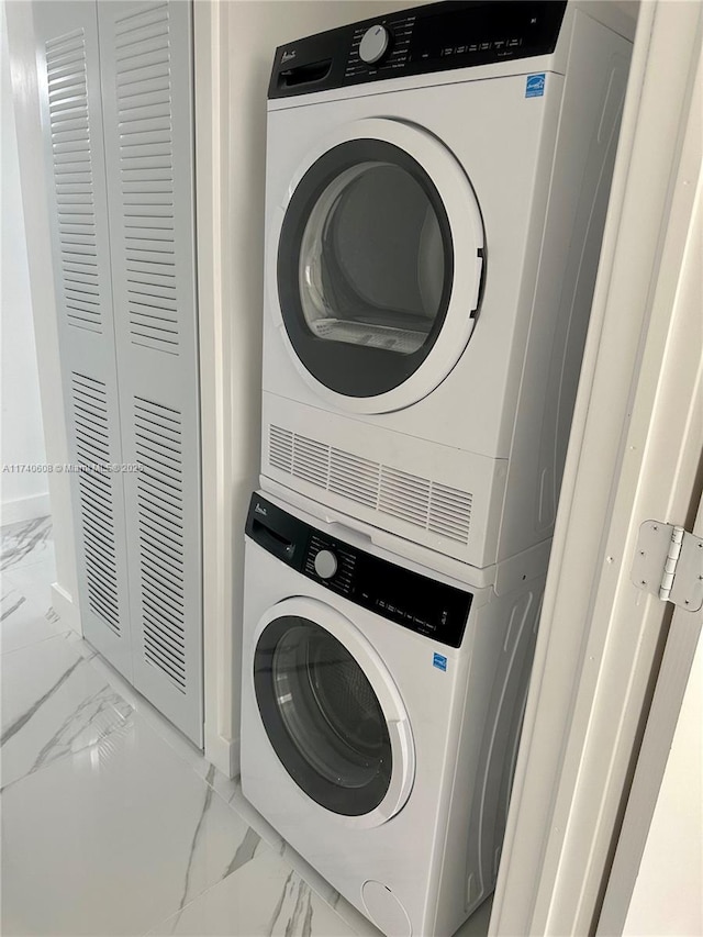 laundry room featuring stacked washer / dryer