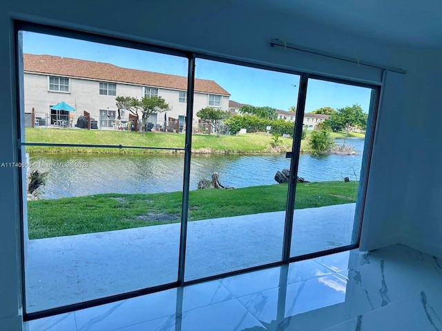 doorway to outside featuring a water view