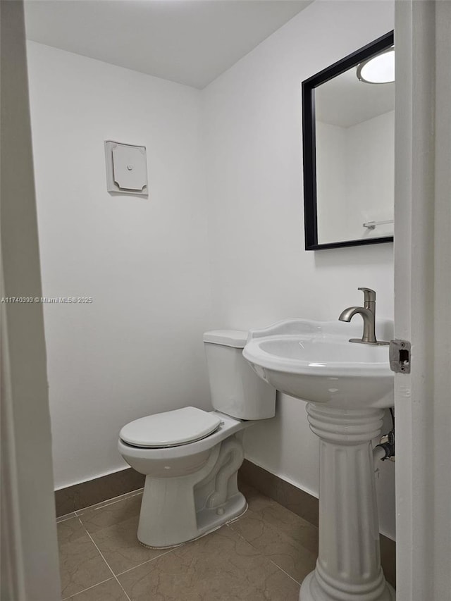 bathroom featuring toilet