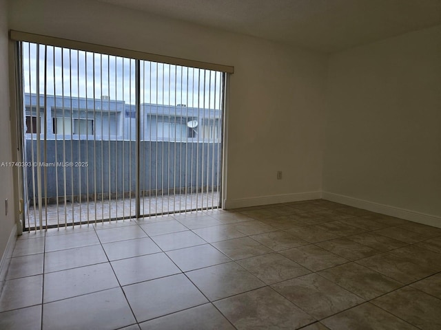 empty room featuring tile patterned floors